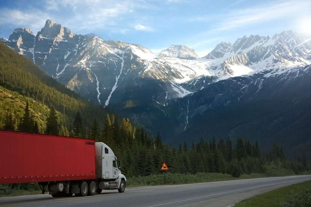 What are the best methods for transporting a car from the USA to Canada?