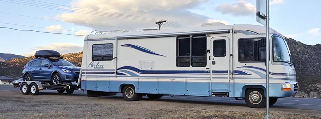 Can I tow my RV behind a vehicle instead of using a transport service?