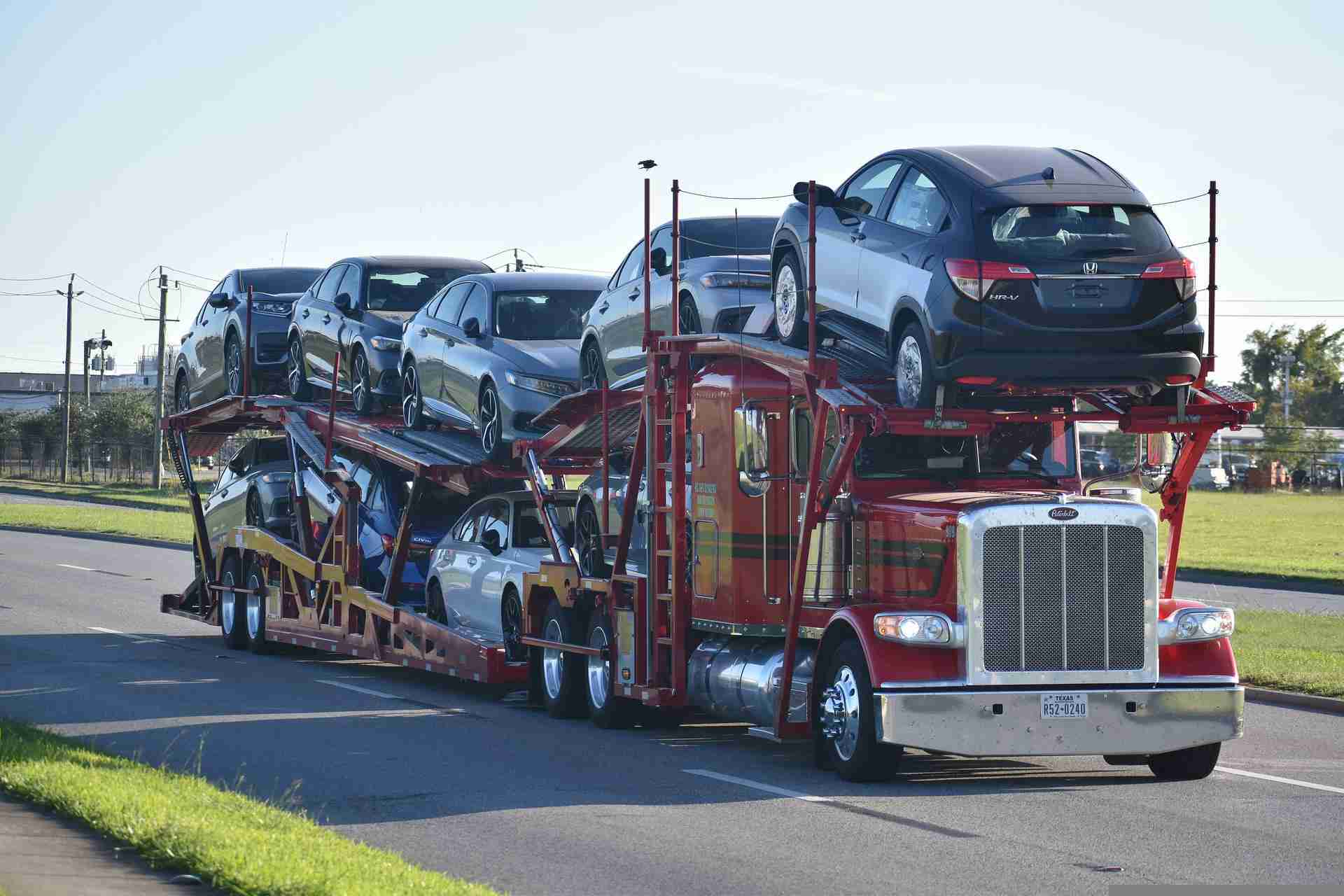 What types of transport trailers are used for car shipping?