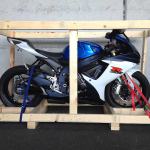 What should I do to prepare my motorcycle for transport?